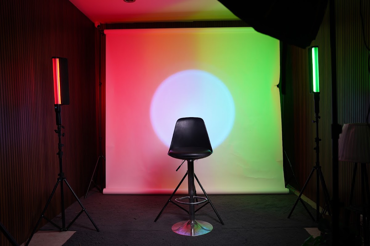 Colour-lit studio backdrop with stool at CT25 Studio